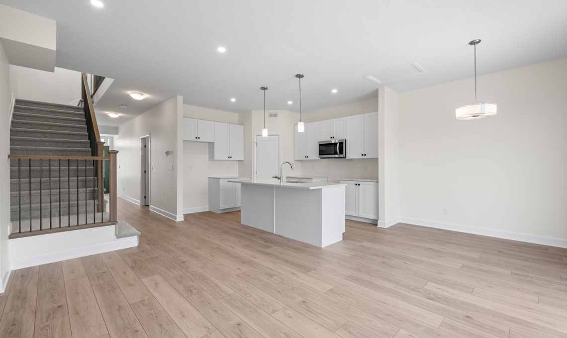 Open concept kitchen, dining, living area