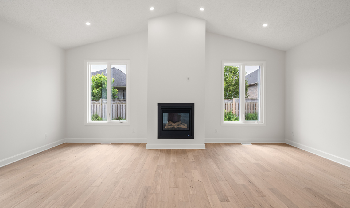 Living room with fireplace and vaulted ceiling