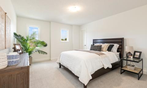 A spacious bedroom with a double bed.